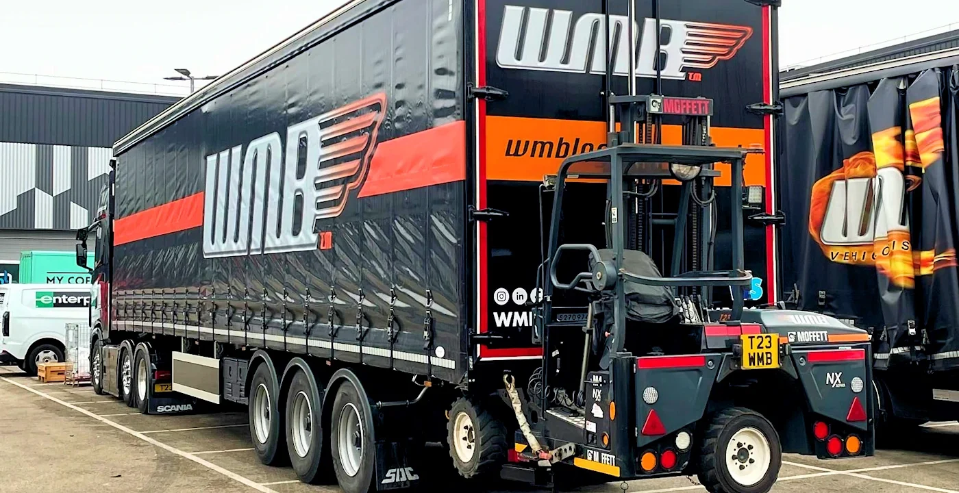Moffett forklift on the rear of a WMB trailer.